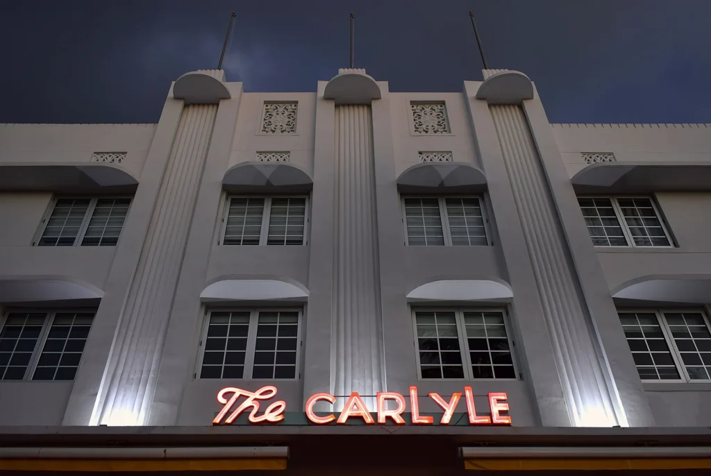 The Carlyle hotel neon sign on Ocean Drive, Miami Beach art deco district at night
