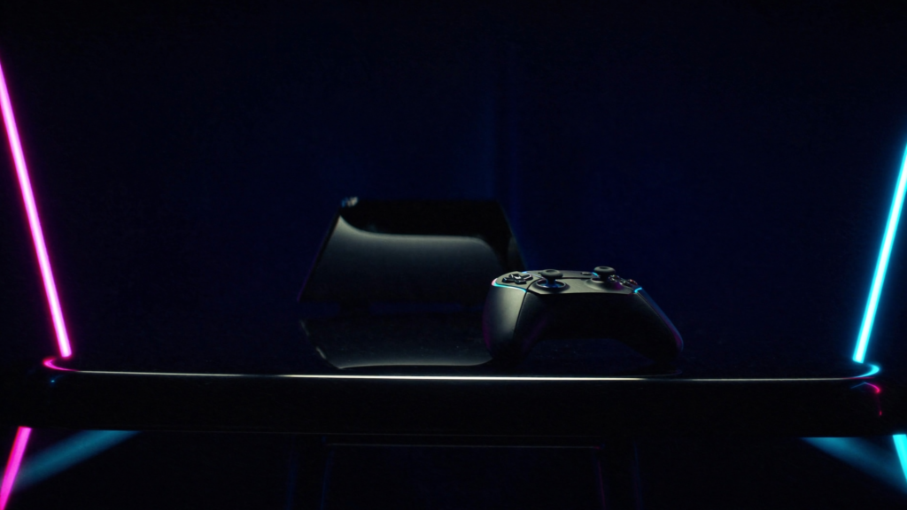 Game console with magenta and cyan neon lighting