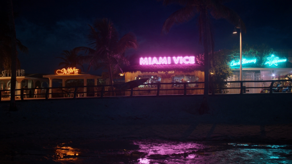 Neon-lit Miami-style beach at night