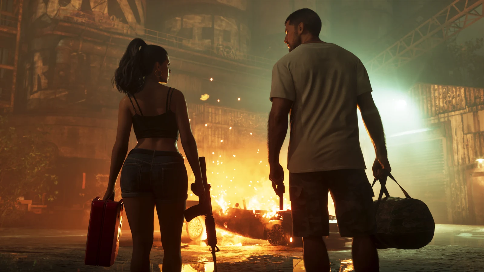 Two armed characters walk away from a burning car in an industrial building.