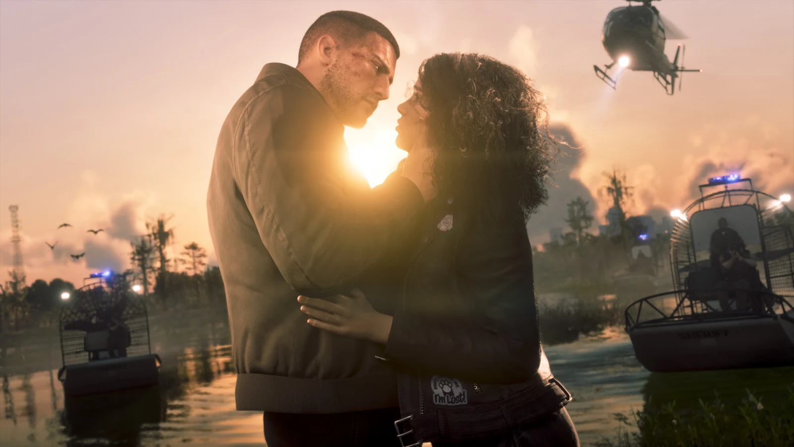 Jason and Lucia embrace in a sunset marsh with airboats and birds behind them.